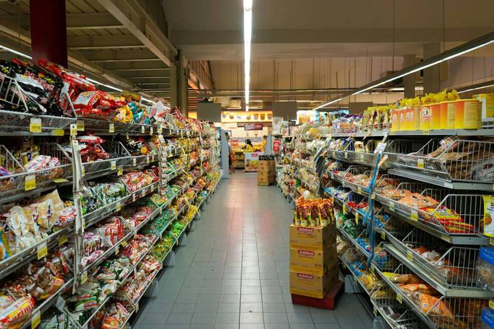 different brands in supermarket aisles